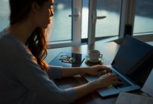 A girl on laptop Writing a Research Design Dissertation